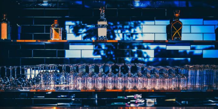 Wooden Table In Front Of Abstract Blurred Restaurant Lights Back